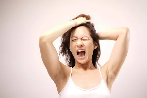 Asian chinese lady yawning after waking up