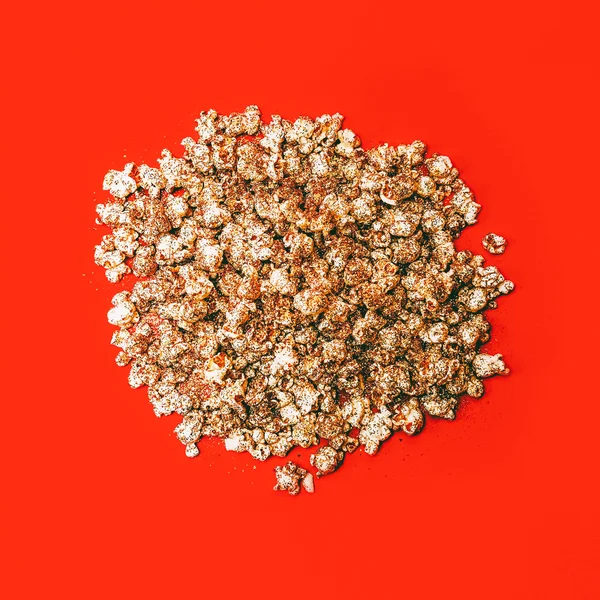 Golden Popcorn on red background. Minimalism style