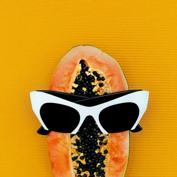 Mix tropical fruit Papaya and fashionable sunglasses. Minimalism