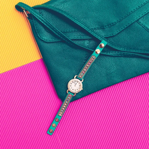 Stylish accessories. Green Leather Clutch and Watches. Be bright