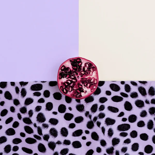 Pomegranate on a stylish background. Minimalism art fashion