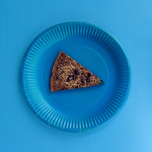 Piece of cake in blue space. Minimalism fashion art.