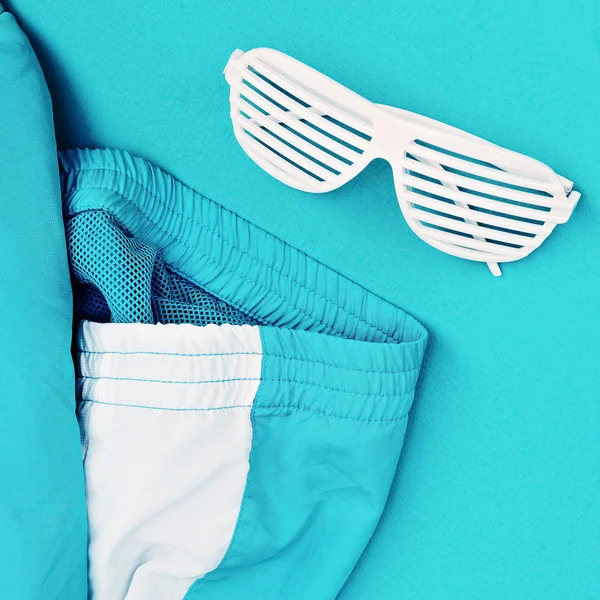 Disco Retro sunglasses on blue. Minimalism art