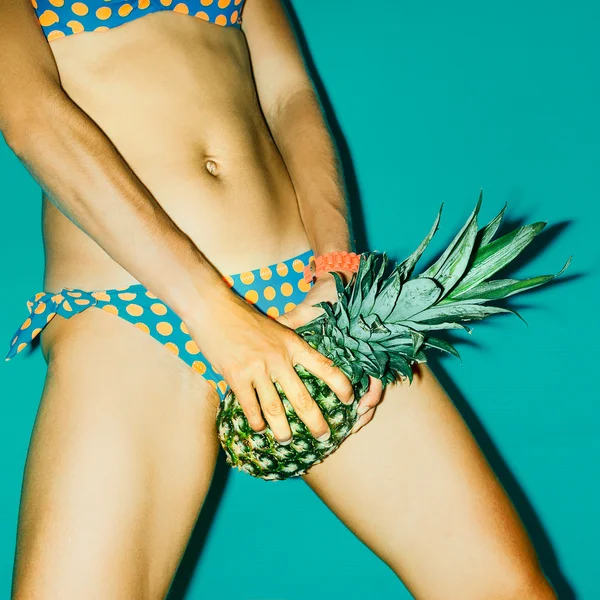 Beach hot party style. Girl with pineapple.