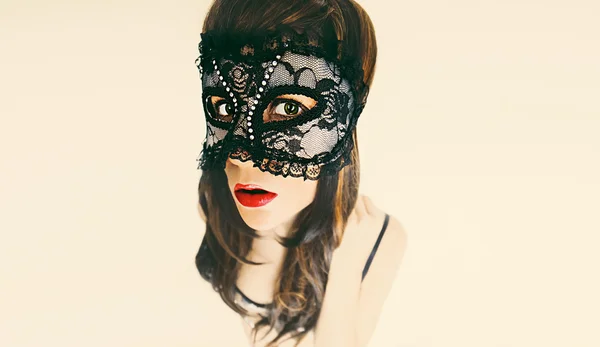 Glamorous brunette lady in masquerade mask. carnival party