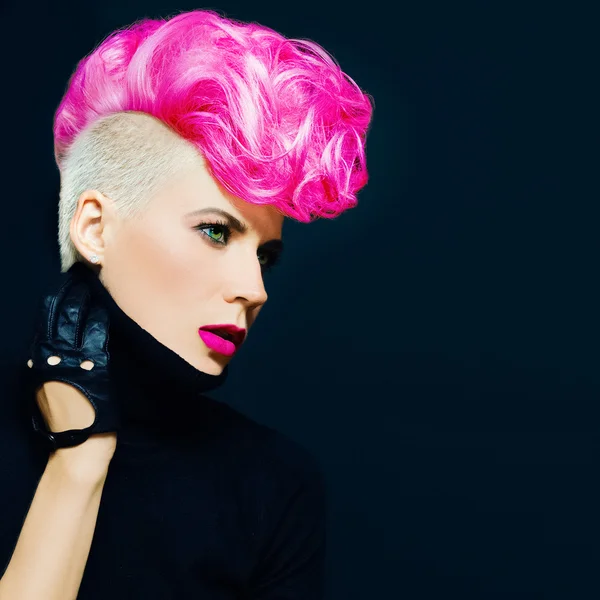 Sensual portrait lady with fashionable haircut colored hair on a