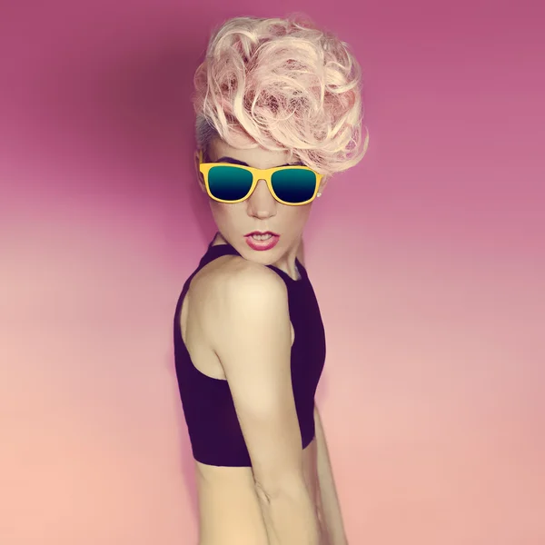 Crazy disco punk Girl on pink background. glamorous party