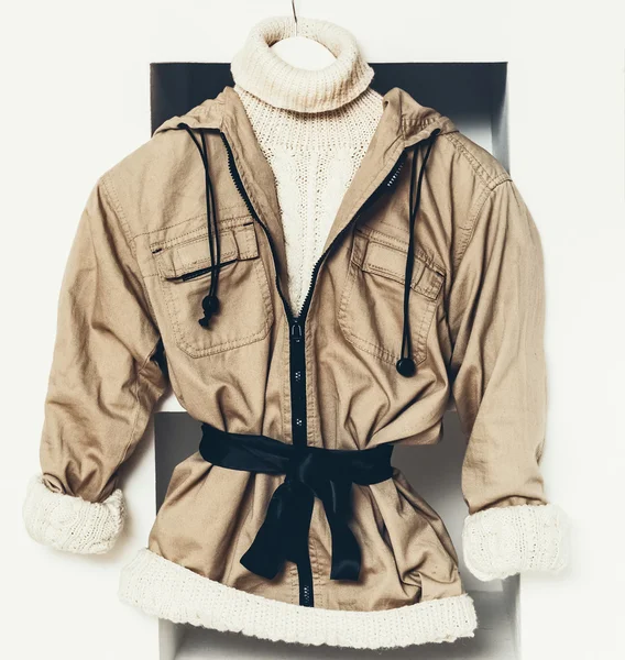 Winter Fashionable Clothing. Beige color in clothing. Urban acti