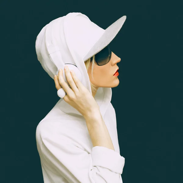 DJ girl in white clothes sports listening to Music on black back