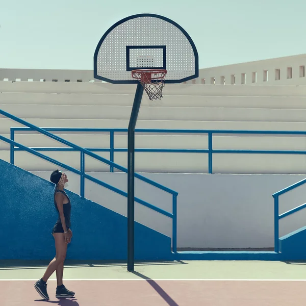 Stylish blonde on the basketball court