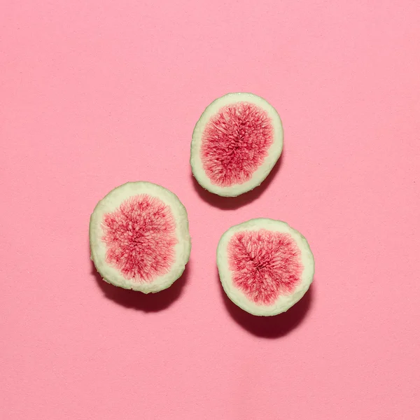Fresh figs on pink background