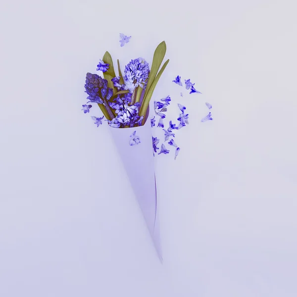 Blue flowers in paper envelope. Love to detail. Minimalism style