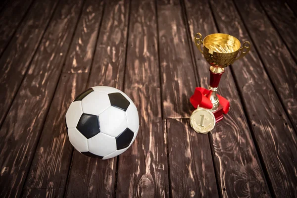 Ball, trophy and medal