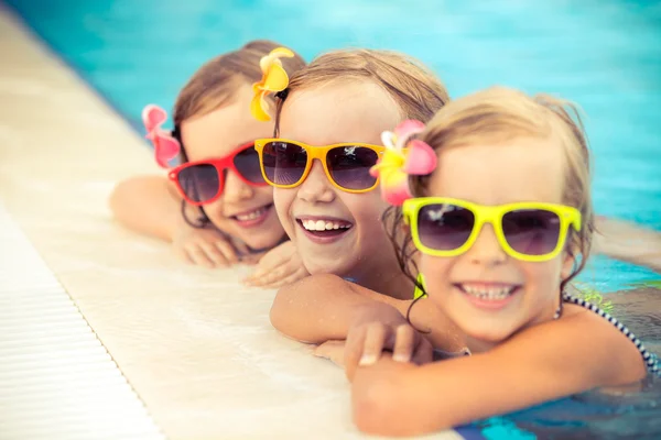 Happy children in the swimming pool