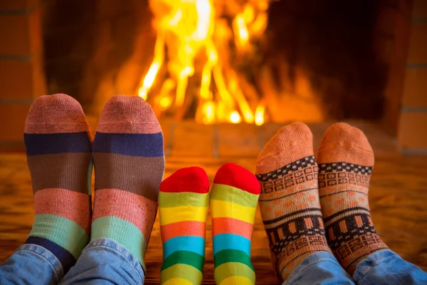 Family near fireplace