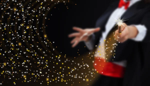 Magician hands with sparkling stars