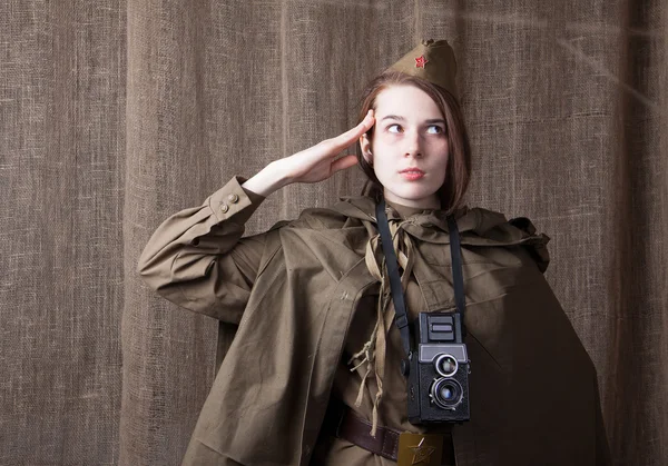 Woman in Russian military uniform with camera. Female war correspondent during the second world war.