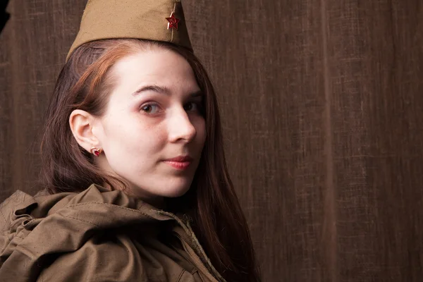 Woman in Russian military uniform. Female soldier during the second world war.