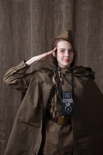 Woman in Russian military uniform with camera. Female war correspondent during the second world war.