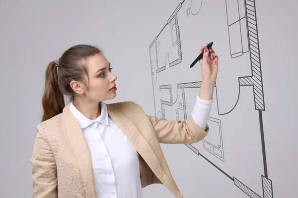 Female architect working with a virtual apartment plan