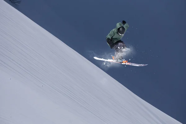 Flying skier on mountains, extreme sport