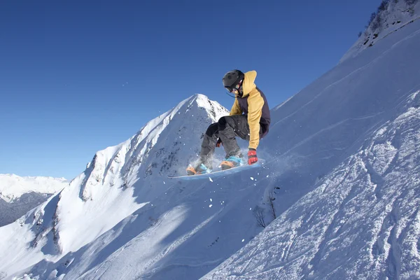 Flying skier on mountains, extreme sport