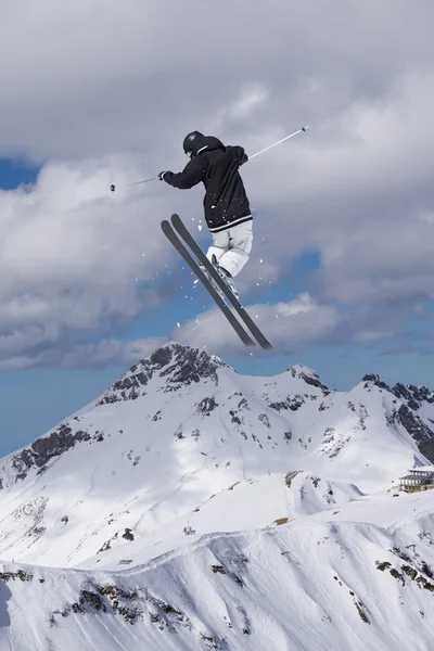 Flying skier on mountains, extreme sport