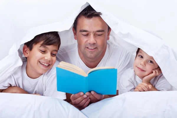 Father reading to his sons