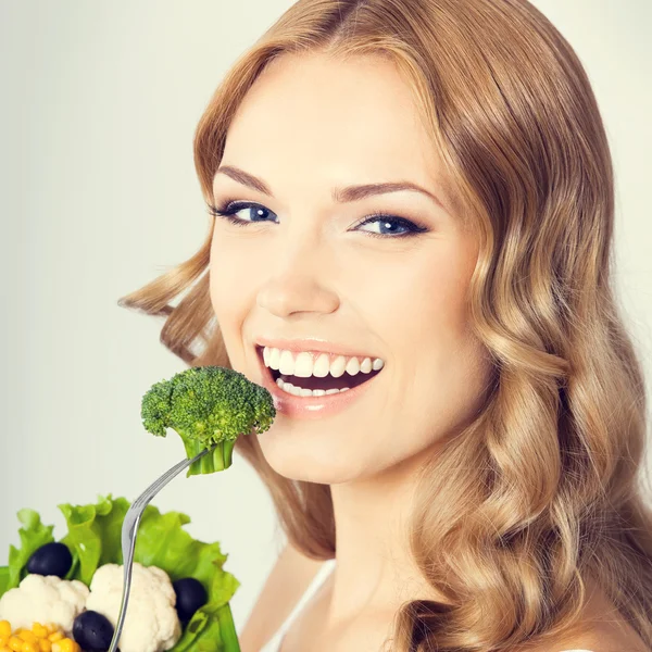 Woman with vegetarian salad