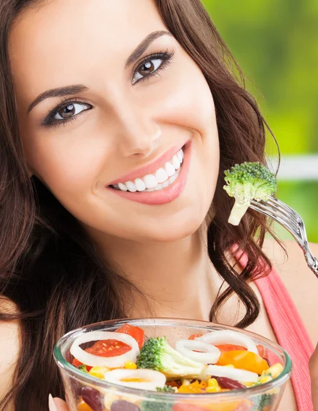 happy smiling woman with salad, outdoor