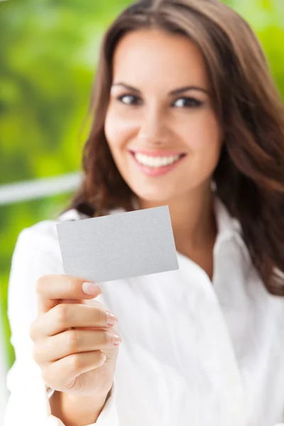 Businesswoman showing blank businesscard