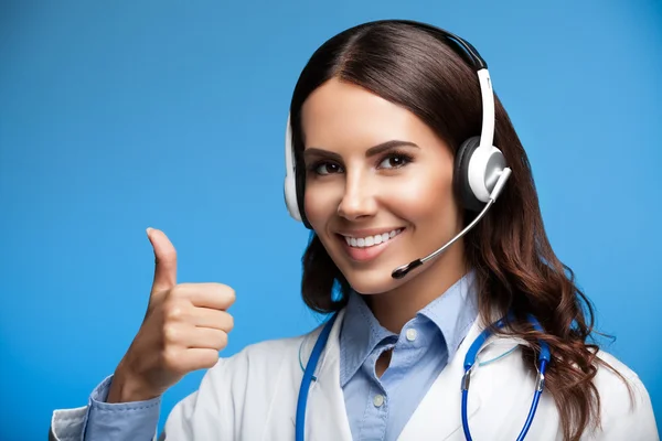 Female doctor in headset, showing thumbs up gesture