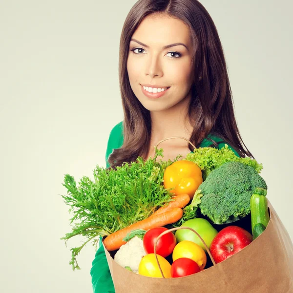 Woman with bag of vegetarian food