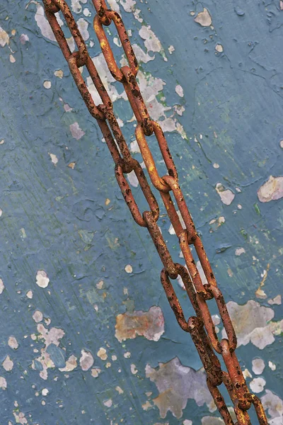 The old coating and rusting metal chain