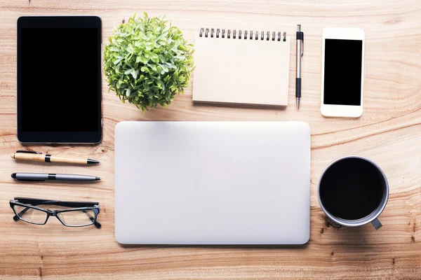 Wooden desk with office tools