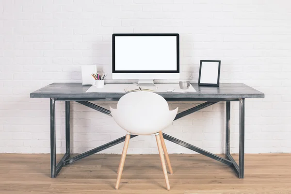 Desk with white monitor