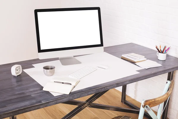 Wooden desktop with white screen