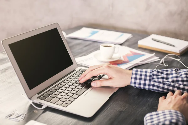 Man typing on laptop