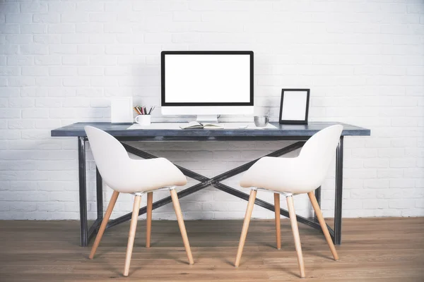 Two chairs at desk