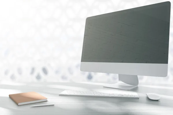 Designer desktop with blank monitor