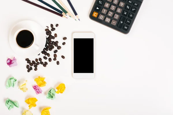 Messy desk with coffee beans