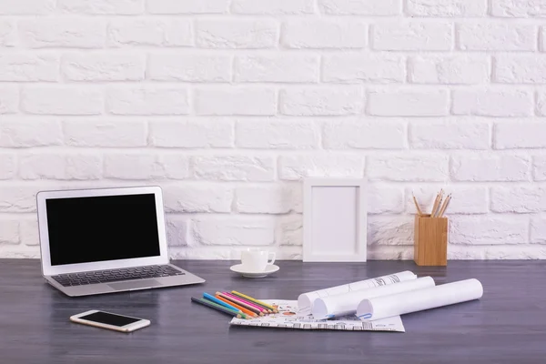 Laptop and phone on desk