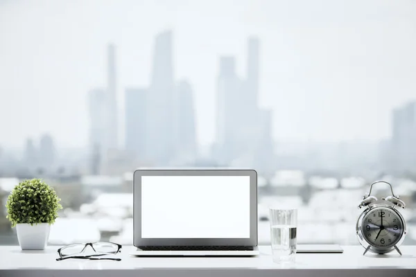 Windowsill with white laptop