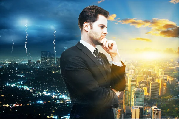 Research concept with thoughtful businessman on stormy and sunny city background
