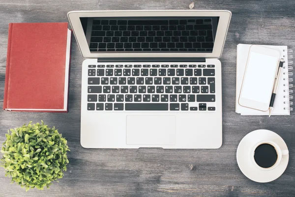 Laptop on wooden desk top