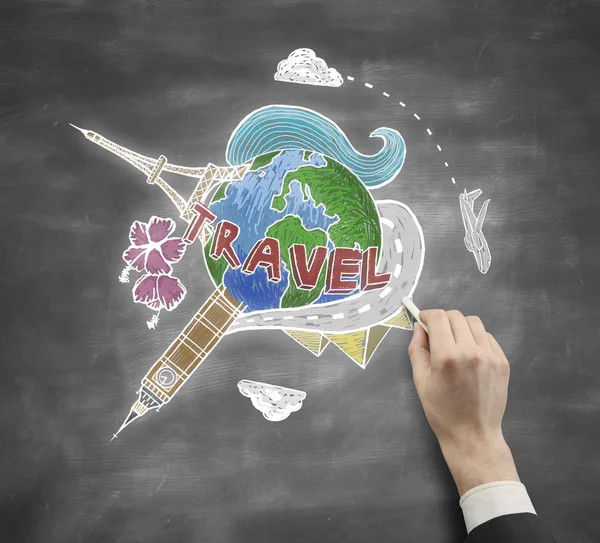 Businessman hand drawing travel sketch on chalkboard background. Traveling concept