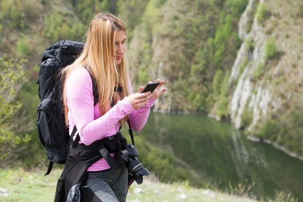 Woman at mountain  on mobile phone