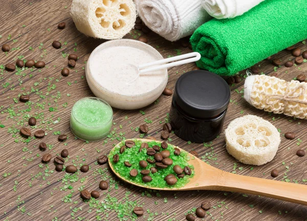 Spa and cellulite busting products on wooden surface