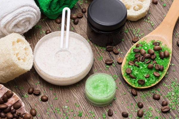 Spa and cellulite busting products on wooden surface