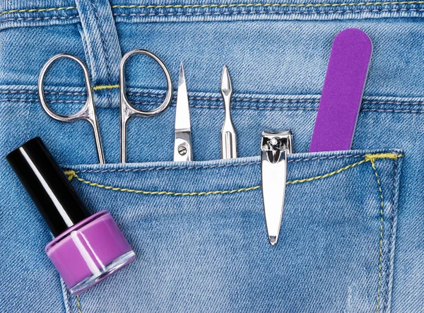 Basic set of manicure tools in jeans pocket